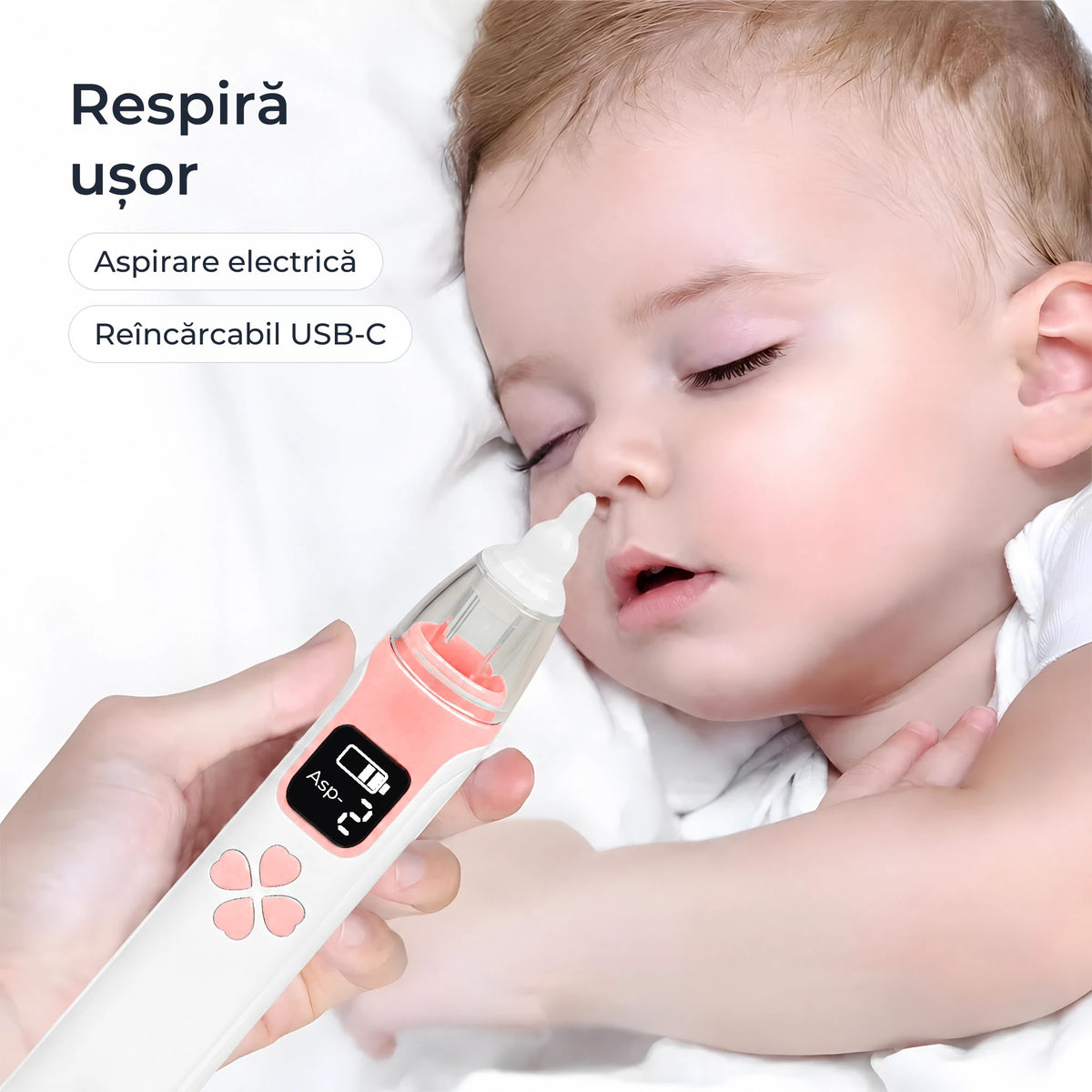 Aspirator nazal electric ținut lângă un bebeluș care doarme 