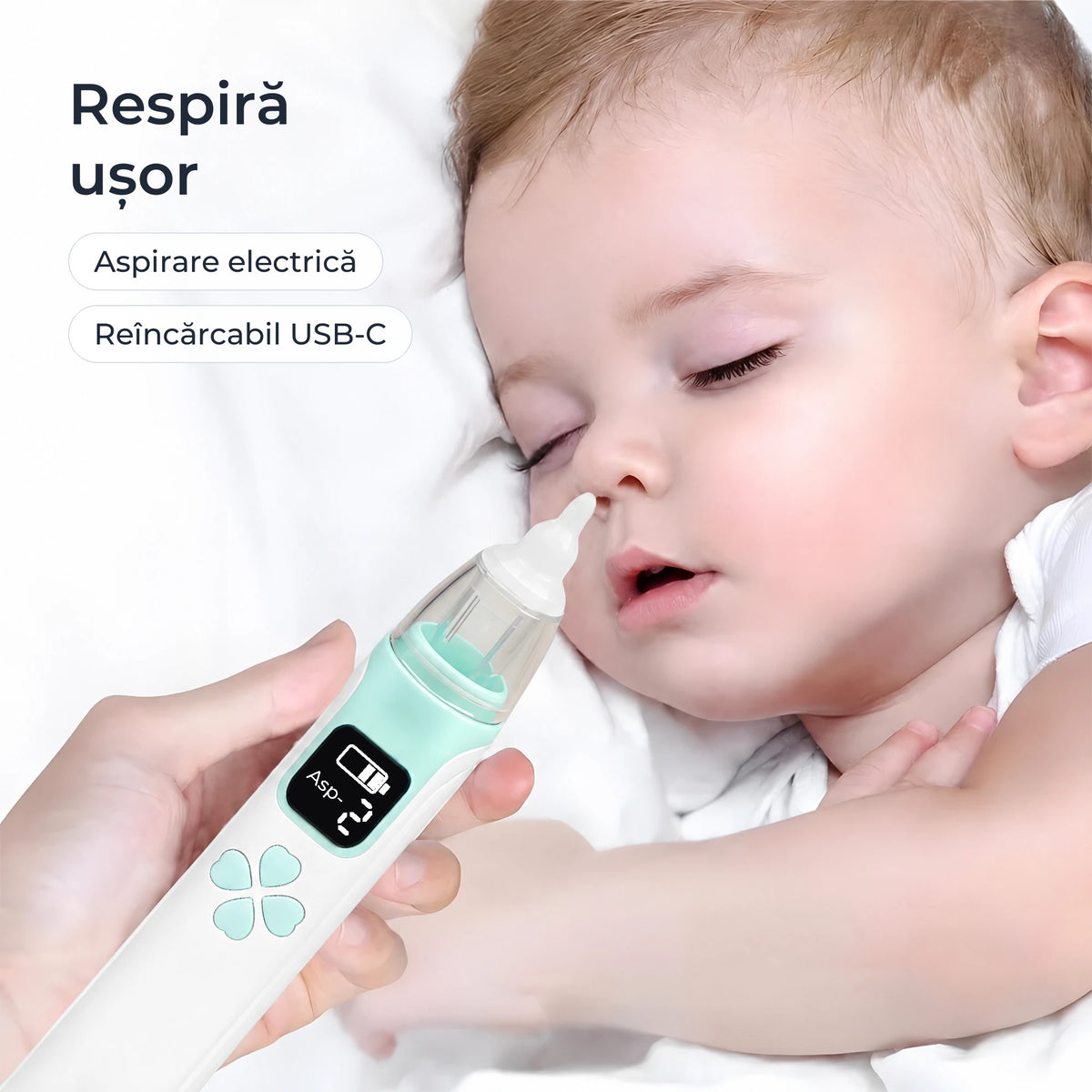 Aspirator nazal electric ținut lângă un bebeluș care doarme 