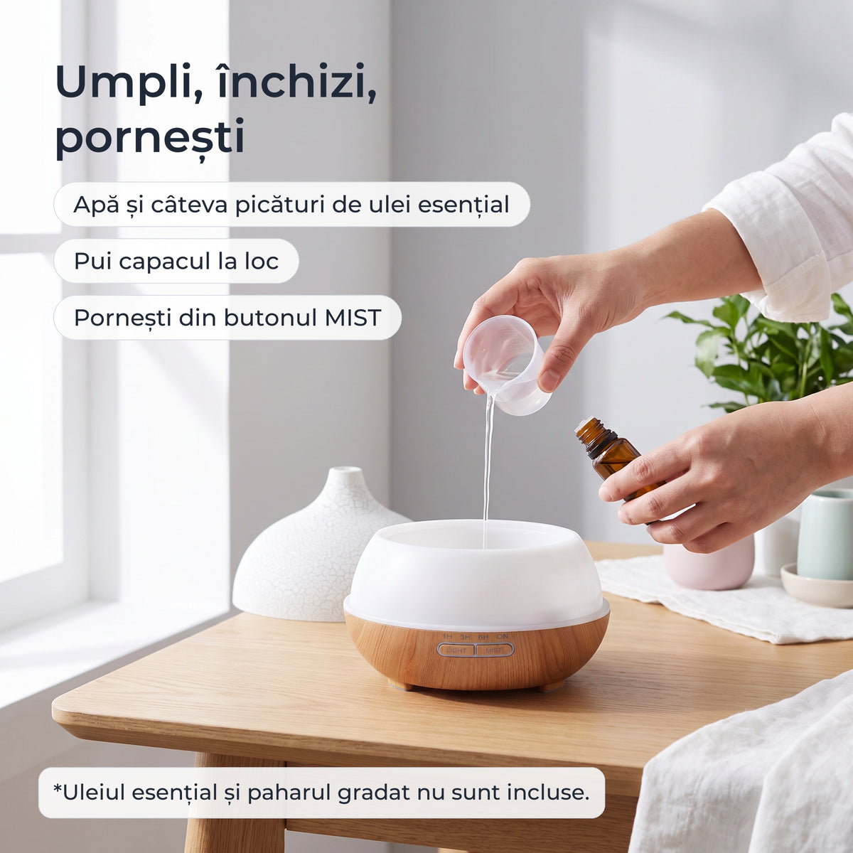 Umplerea rezervorului cu apă și câteva picături de ulei esențial
